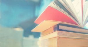 Open,Book,On,Wood,Desk,In,The,Library,Room,With